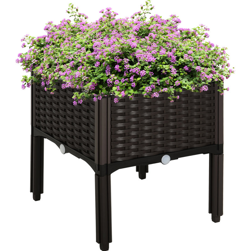 Boîte à fleurs brune surélevée pour jardin
