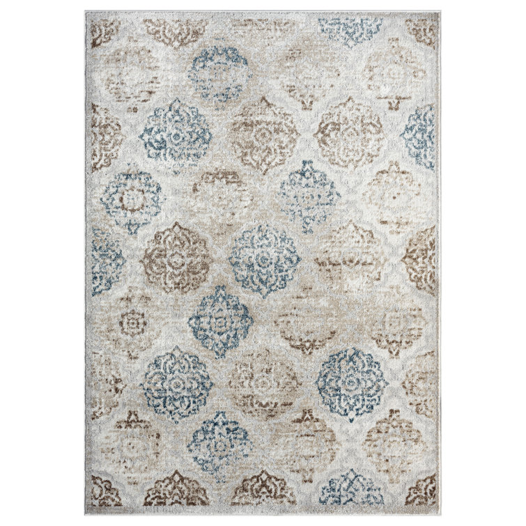 Tapis ivoire à motif géométrique