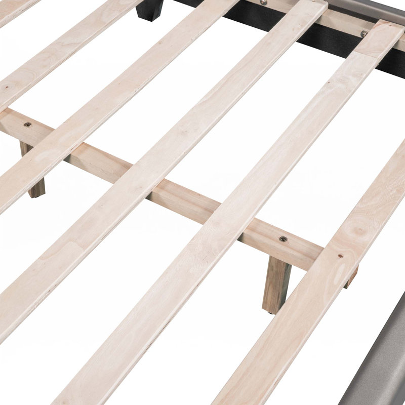 Lit plateforme tapissier en similicuir