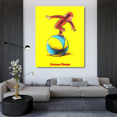 Curieux George joue sur une balle