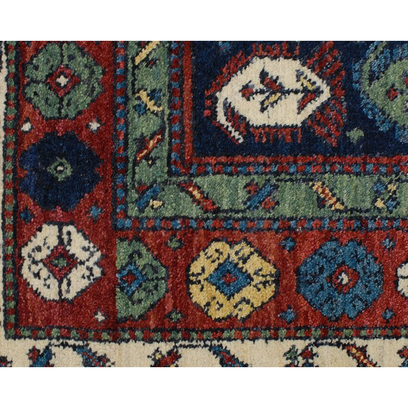 Seychour Wool Oriental Area Rug in Green/Red