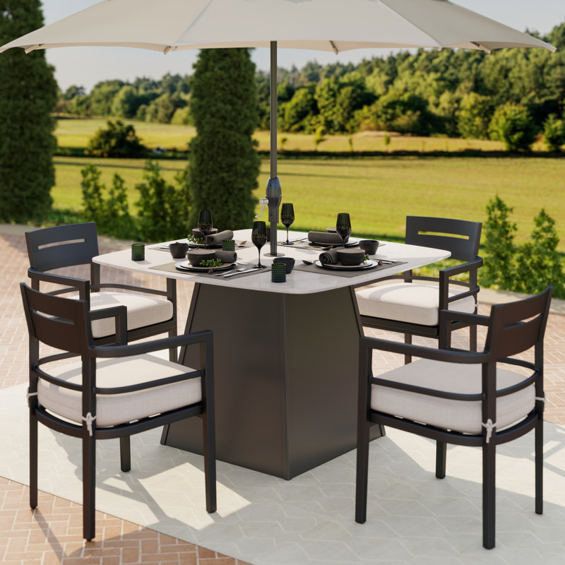 Ensemble repas carré blanc en aluminium 5 pièces avec coussins Sunbrella et 4 fauteuils