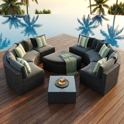 7-Piece Outdoor Wicker Sofa Set with Gray Cushions & Green Striped Pillows