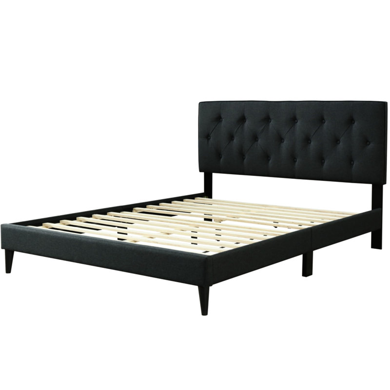 Lit double tapissier dans une boîte avec tête de lit et revêtement en tissu noir