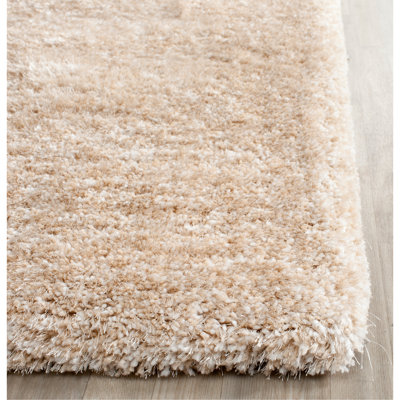 Delane Handmade Shag Champagne Area Rug