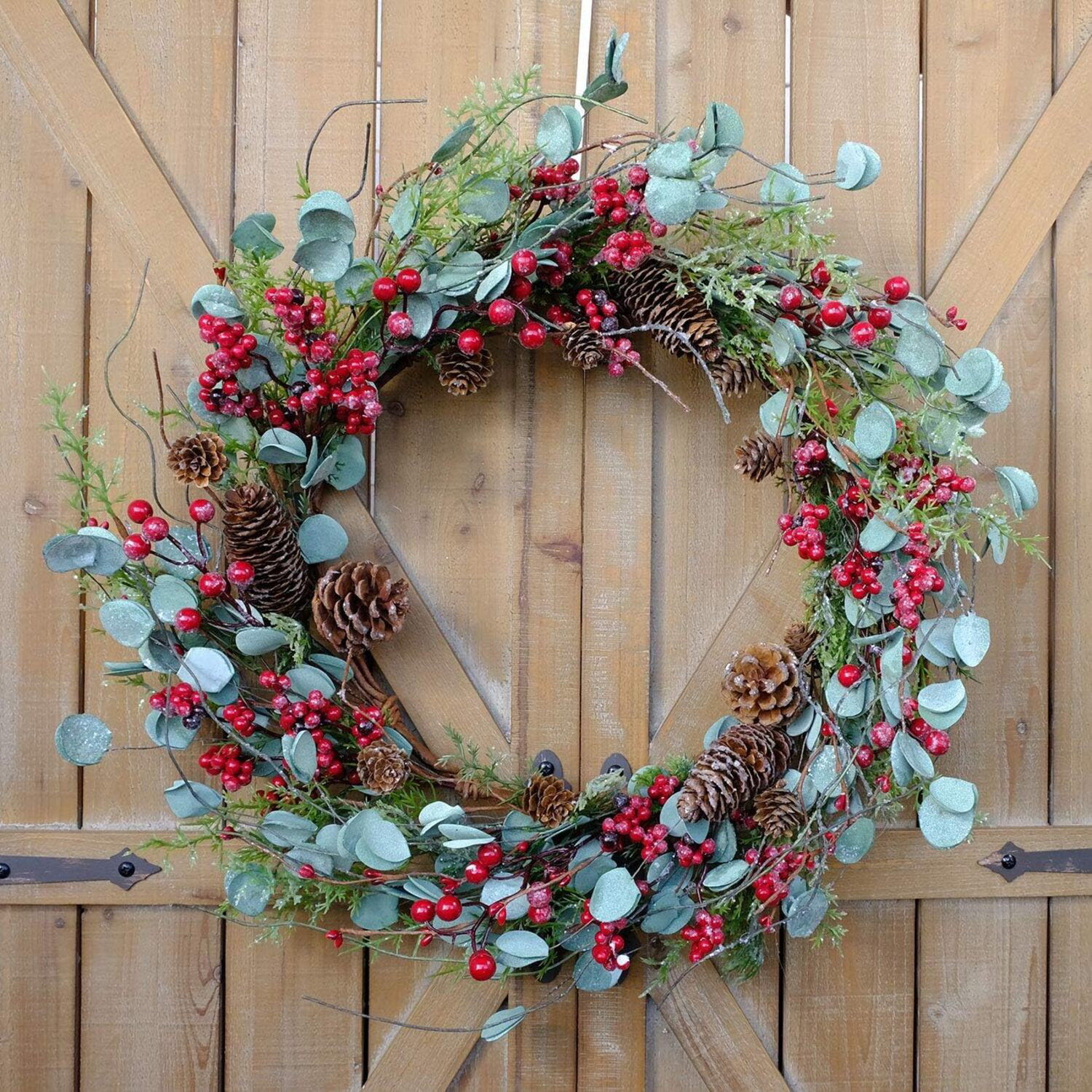 August Grove® A Christmas Wreath With Red Berries, Pine Cones, And ...