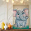 Toile, un joyeux éléphant se tient debout dans une pose ludique, exaucant l'art mural «Joy and Innocence» avec ses grands yeux expressifs-1862631780