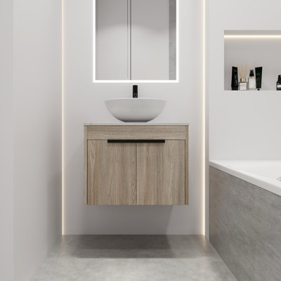Meuble-lavabo moderne avec lavabo en céramique. Porte murale en chêne blanc à fermeture en douceur et rangement suffisant. 24 po.