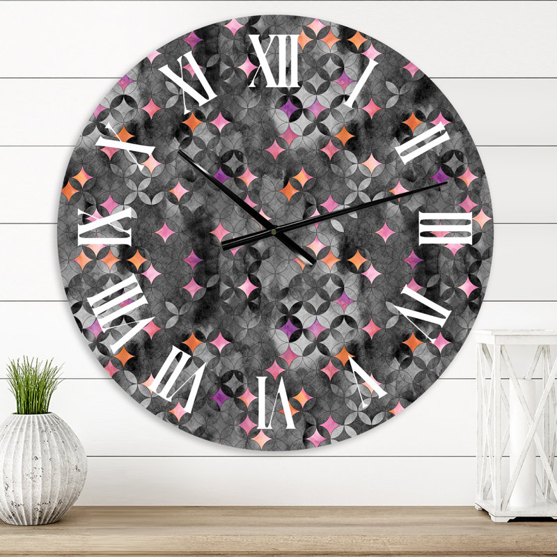 Horloge murale moderne à cercles géométriques entrecroisés avec des étoiles roses, Moyen