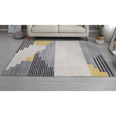 Tapis gris touffeté à la main