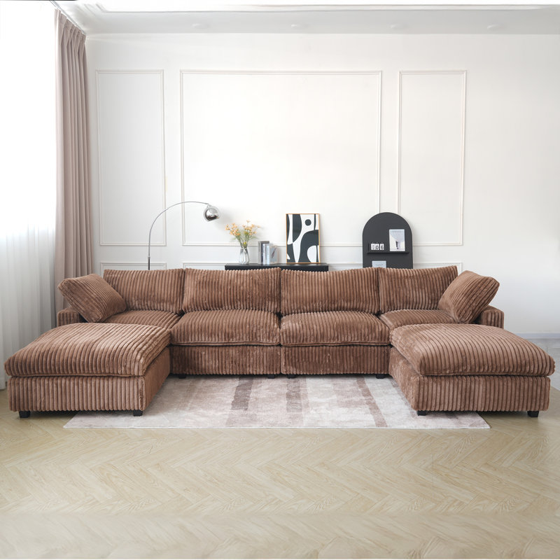 Canapé modulaire à accoudoirs larges avec repose-pieds Doris, Fausse fourrure brune
