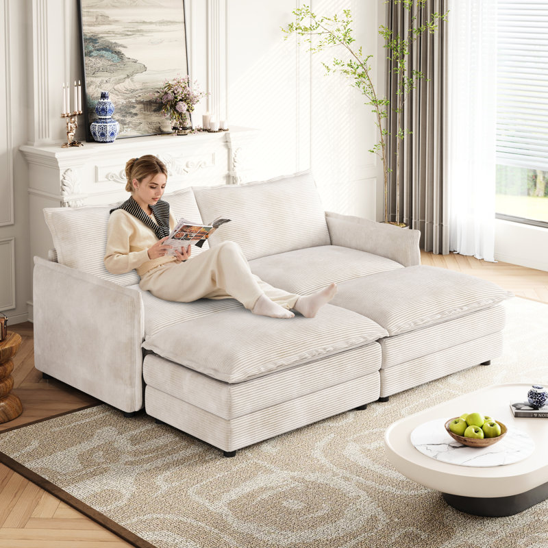 2 fauteuils en velours côtelé pour des moments de détente, repose-pieds amovibles, structure en bois massif, fauteuil inclinable profond, revêtement en tissu, ambiance calme dans le salon, avec 2 poufs, construction, intérieur confortable