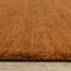 Tapis en laine rouille unie Makhari-1003433167