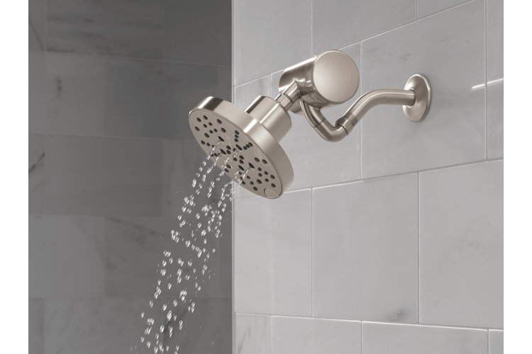 closeup of a chrome shower head with a filtration system