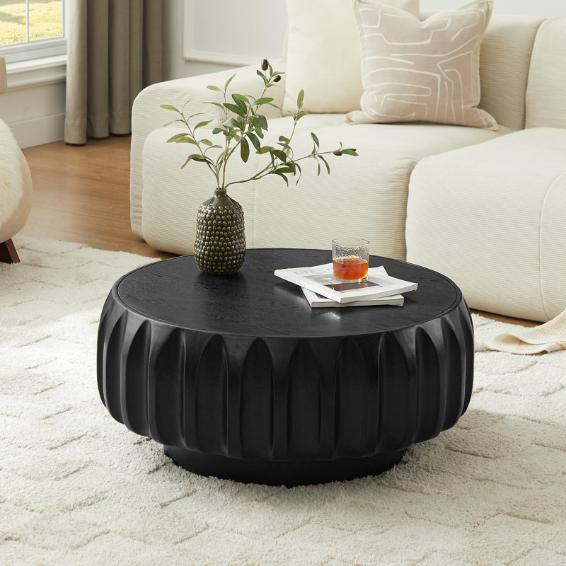 Table basse ronde en bois massif sculpté