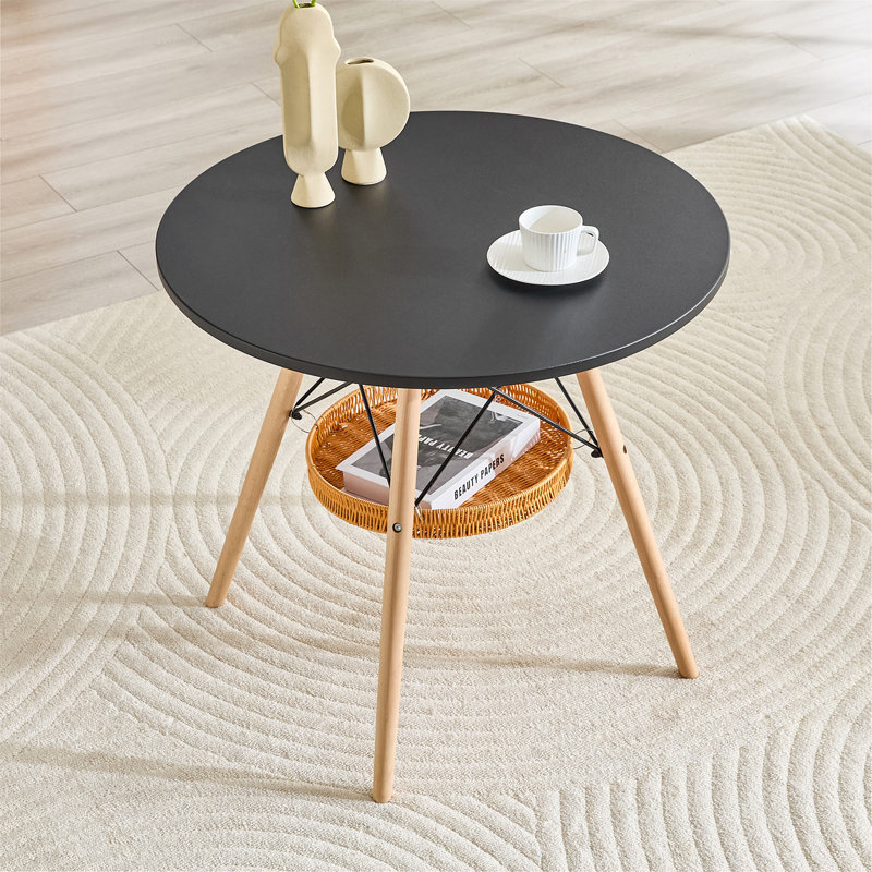 Table de salle à manger circulaire de 31,5 pouces de diamètre, plateau en panneau de fibres à densité moyenne noir, pieds en bois massif, avec structure de panier de rangement suspendue. Une table basse décontractée pouvant accueillir de 2 à 4 personnes.