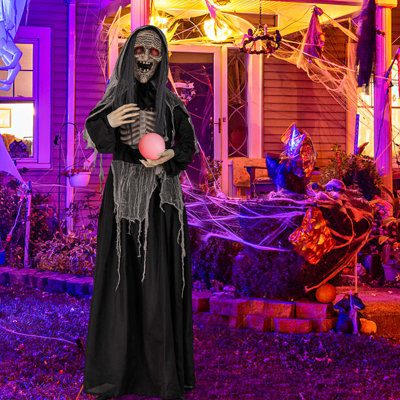 Sorcière debout animée 6 pi d'Halloween animée parlant une sorcière avec des yeux illuminés et un son de boule magique activé