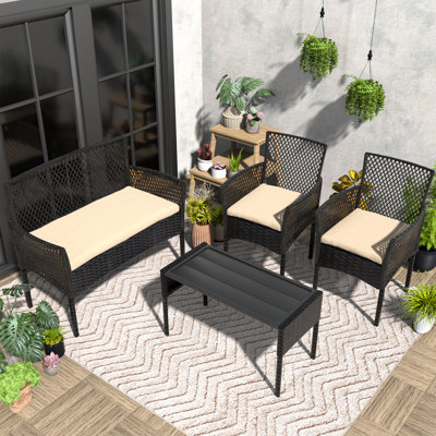 Ensemble de conversation 4 pièces en rotin avec coussins, table basse pour porche, jardin, bord de piscine et jardin