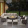 Ingvald 8- Person Outdoor PE Wicker Patio Conversation Set with Fire Pit, Ottomans and Cushions