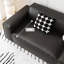 Causeuse-coussin modulable noire en cuir véritable
