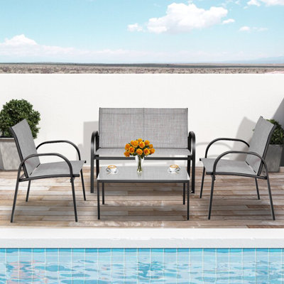 Middelburg Outdoor 4 Pieces Patio Furniture Set with Glass Top Coffee Table