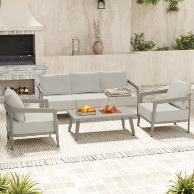 Trombley 4-Piece Aluminum Wicker Patio Conversation Set With 3-Seat Sofa, Coffee Table And Grey Cushions