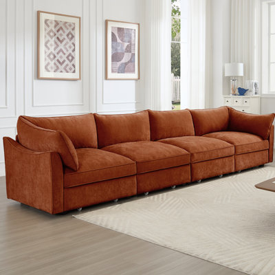 Canapé orange à quatre places en chenille avec très grands sièges larges, coussins enroulés et accoudoirs, rangement escamotable sous plusieurs options de couleurs, rangement caché pour personne, en forme de croissant