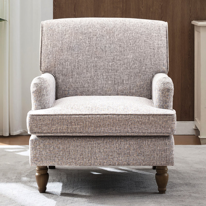 Fauteuil crème rétro avec revêtement en lin et pieds tournés en bois d'hévéa antique, pour lire un magazine dans un livre rembourré confortable