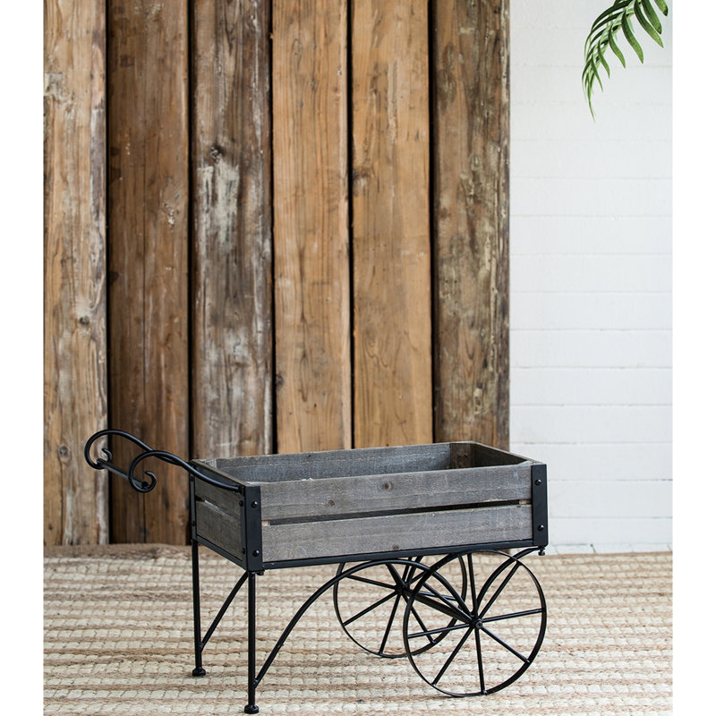 Rustic Black Trolley Cart Plant Stand With Wheels And Pine Wood Sections, 24.4X12.6X15.4 Inches, 9.9 Lbs, Decorative Touch Antique Brown Planter Two Back Legs Curved Handle, Lbs