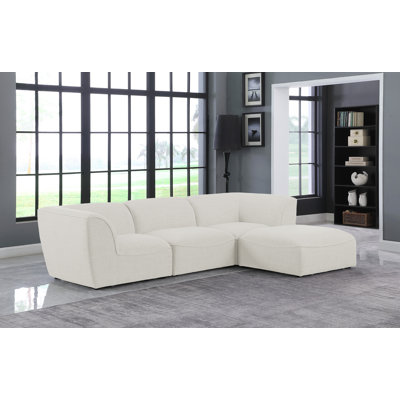 Camani Upholstered L-Shaped Sectional with Ottoman Reversible