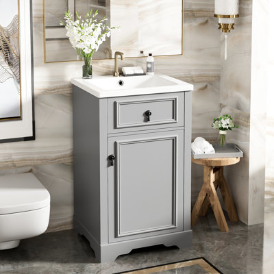 Meuble-lavabo de 20 pouces avec lavabo en céramique, porte à fermeture en douceur et tablette réglable pour une utilisation pratique et flexible
