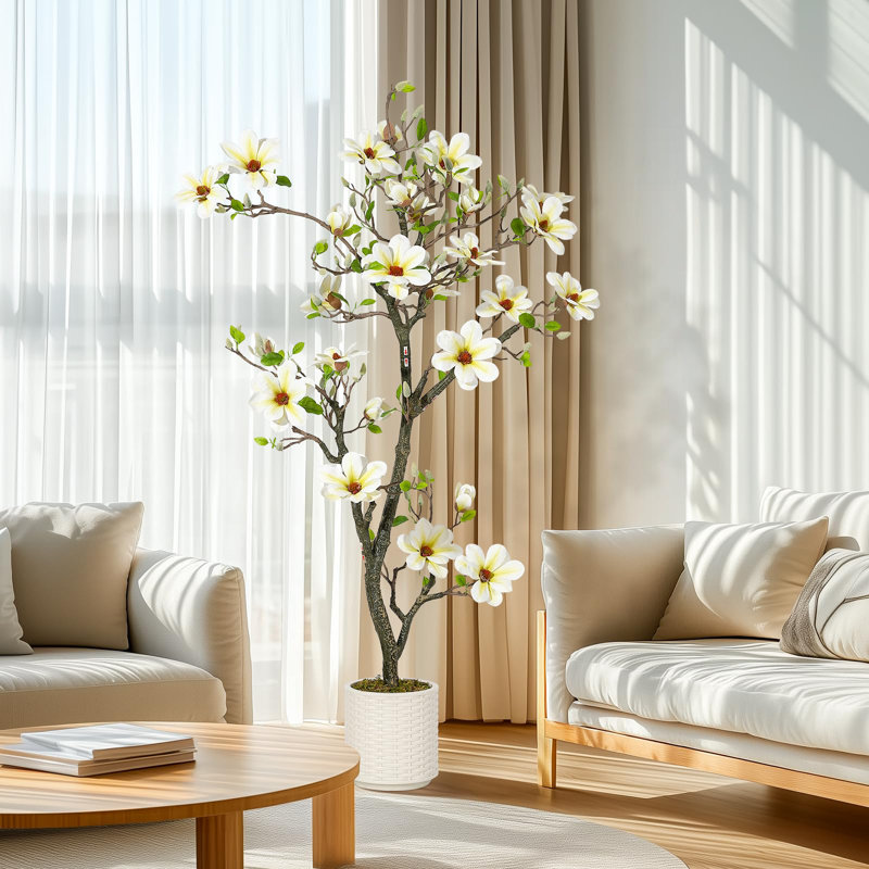 Magnolia artificiel avec des fleurs blanches réalistes et des feuilles vertes luxuriantes