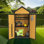 Armoire de rangement extérieure en bois résistante aux intempéries avec toit imperméable, portes verrouillables et table pliable