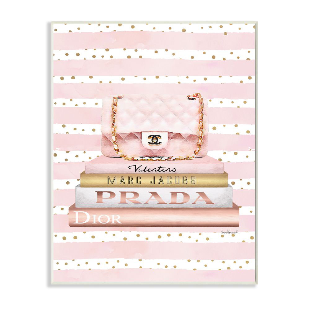 " Pink Designer Bag On Fashion Bookstack Over Pattern " by Amanda Greenwood Stupell Industries 