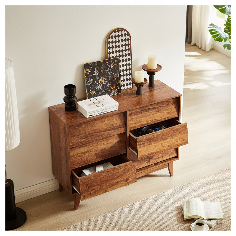 La commode double 6 tiroirs présente un style rétro et un design biseauté
