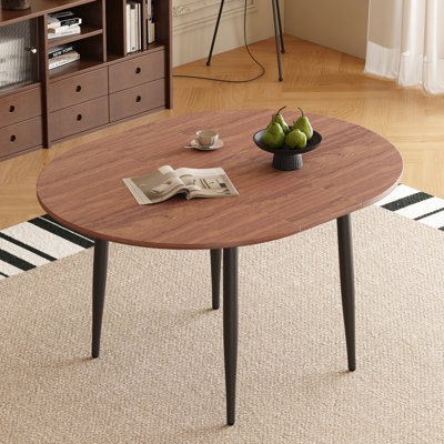 With a clever retractable mechanism, the Walnut Colour MDF table top and black metal legs and has a smooth and delicate surface.