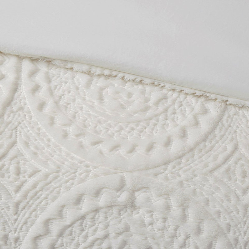 Édredon simple en fausse fourrure, motif médaillon brodé