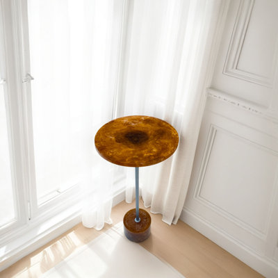 Amber Glow Pedestal Accent 25 Inch Round Resin Side Table with Nickel Base by Ebern Designs