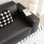 Causeuse-coussin modulable noire en cuir véritable