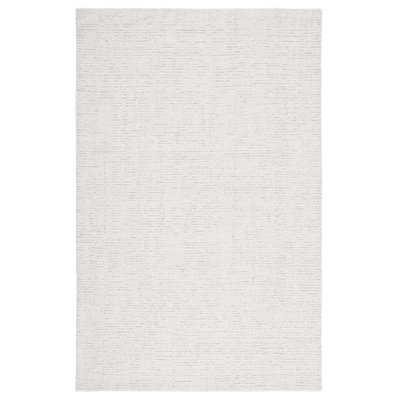 Tapis ivoire / beige en laine touffeté à la main