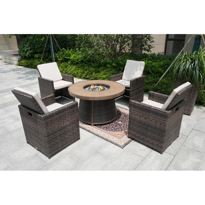 Areefa 4 - Person Wicker Patio Dining Set with Round Table , Cushions Included