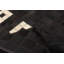 Tapis noir en peau de vache Hanika