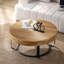 Table basse moderne et ronde à motif sculpté en bois avec pieds en métal