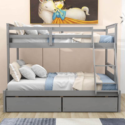 Lit superposé simple au dessus d'un lit double en bois avec 2 tiroirs de rangement
