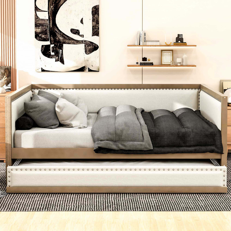 Lit de jour rembourré avec couchette et décoration cloutée