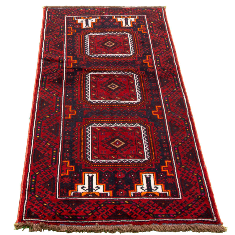 Tapis rouge foncé en laine noué à la main