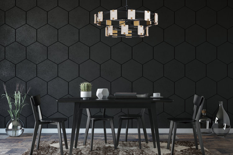 large-scale black hexagonal wall tile . black dining table set with round chandelier