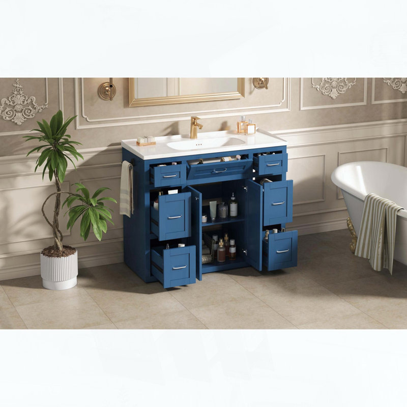Meuble-lavabo sur pied avec lavabo en céramique, six tiroirs, tiroir central rabattable, portes doubles à fermeture amortie et porte-serviettes réversible, bleu marine