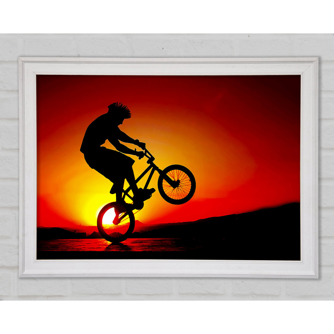 Gerahmtes Poster BMX Back Wheelie In Red Sunlight