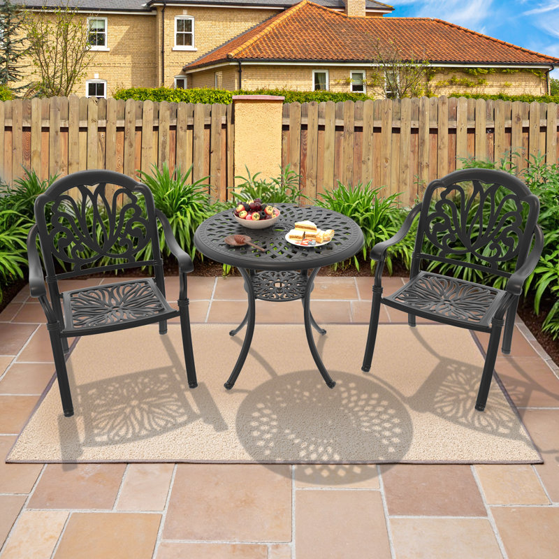 Ensemble repas Amitava pour 2 personnes avec table ronde et coussins bruns inclus